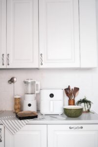 Luxury minimalist kitchen featuring premium countertop appliances for fast, convenient, and organized meal preparation.
