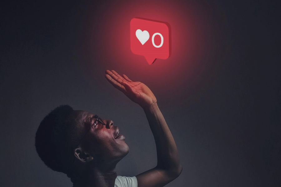 This is an interesting image of a person reaching toward a glowing notification icon, symbolizing a "0 likes" count. It carries a strong metaphor about the impact of social media validation and engagement. Let me know if you want to edit or caption it for a specific purpose!